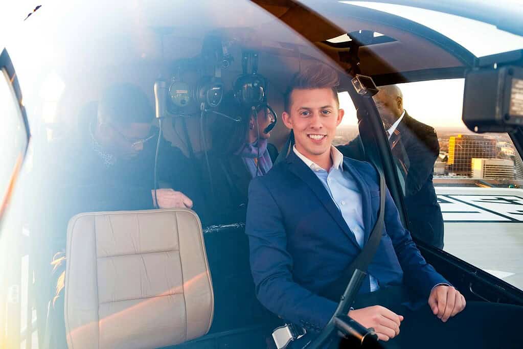 man sitting inside helicopter